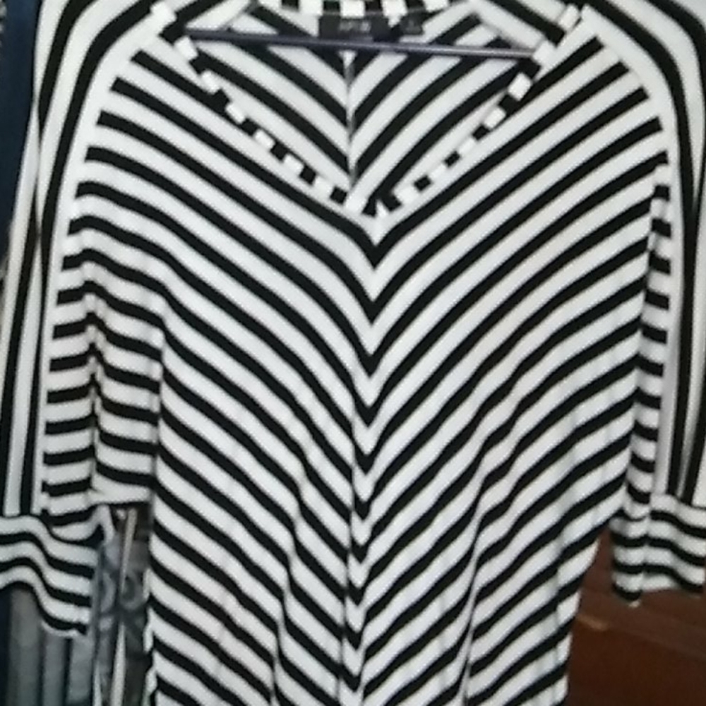 Very cute top.  Dress it up or down. Pair with leg